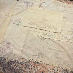 7 cross stitched, various sized liners and dollies